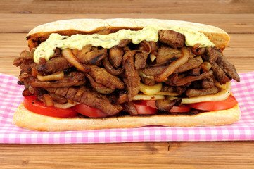 Fried beef and onion filled sandwich sub roll