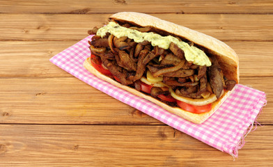 Fried beef and onion filled sandwich sub roll