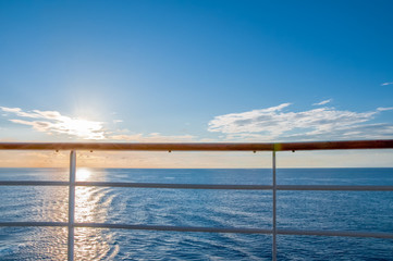 Railing of a cruise ship, sunset on the sea