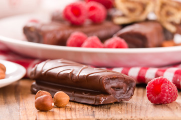 Chocolate rolls with hazelnuts and raspberries.