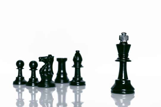 Black Chess on white background . Leader and teamwork concept for success.