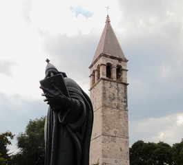 Bell tower behind the statue of Gregory of Nin – Split, Croatia