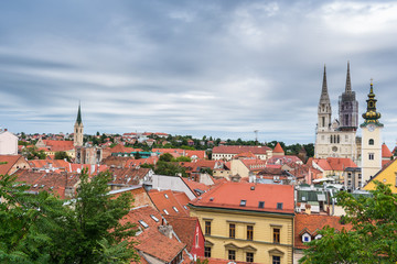 Fototapeta na wymiar View from an upper old town view on church and cathedral towers and rooftops in Zagreb, capital of Croatia