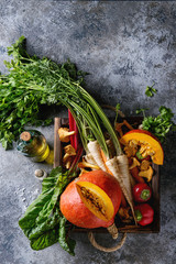 Variety of autumn harvest vegetables carrot, parsnip, chard, paprika, hokkaido pumpkin, porcini and...