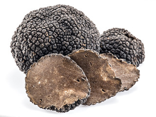 Black truffles isolated on a white background.