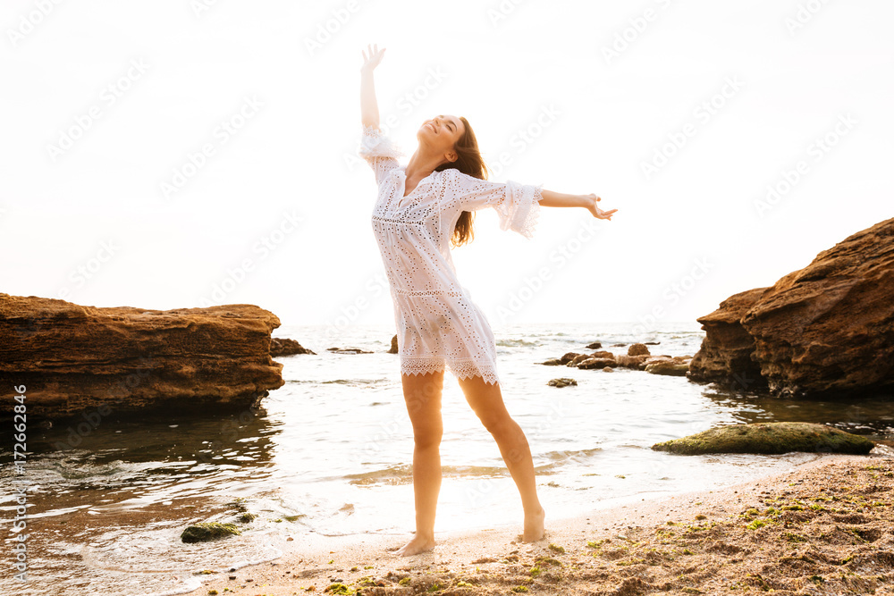 Poster Full length image of happy woman in light summer dress