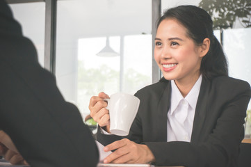 Business woman meeting in morning with coffee cup feeling happy and smile