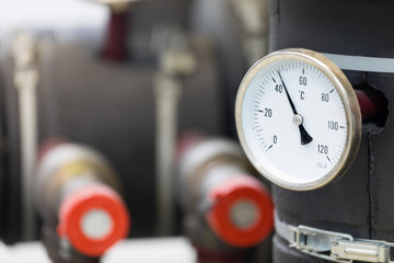 industrial analog thermometer at the boiler room