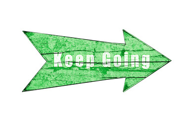 Green vintage wooden direction arrow sign on a cracked and peeling wooden plate isolated on a white empty seamless background with white text "Keep Going".