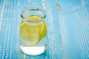 lemonade in bank on a blue background/lemonade in glass on a blue background