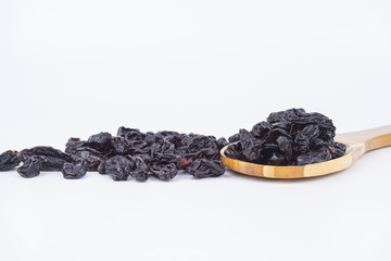 Concept Sweet dry raisins black and yellow isolated on the white background