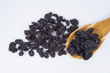 Concept Sweet dry raisins black and yellow isolated on the white background