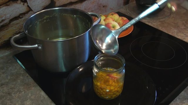 Woman pours compote