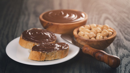 two baguette slices with chocolate hazelnut spread