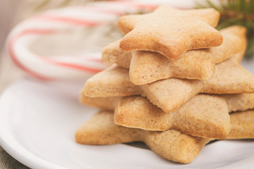 star cookies and candy cane on table