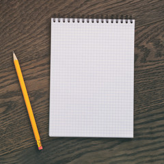 open notebook for writing or drawing on oak table