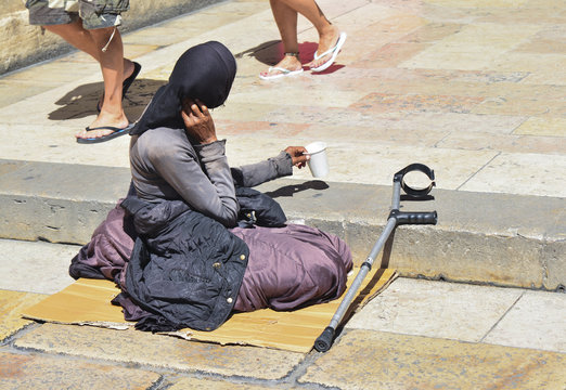 Poor Woman Begging In The Street