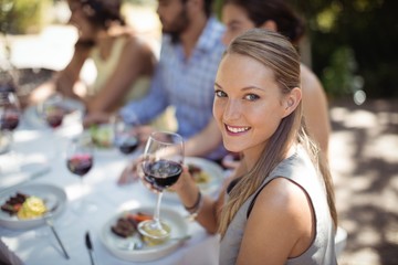 Woman holding a wine glass in restaurant