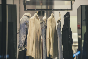 Women clothing on racks in a fashion store