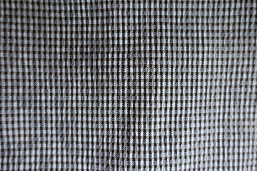 Closeup of surface of dark grey fabric