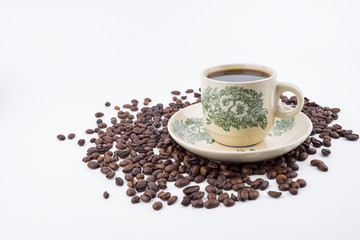 Concept roasted coffee beans and hot coffee with isolated white background