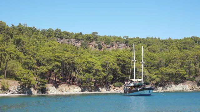 Boat Anchored Near The Natural Beach Of Phaselis Antique City, Antalya, Turkey