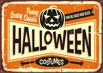 Fototapeta premium Halloween costumes shop vintage advertising sign with pumpkin head and promotional messages. 