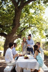 Group of friends interacting with each other while having