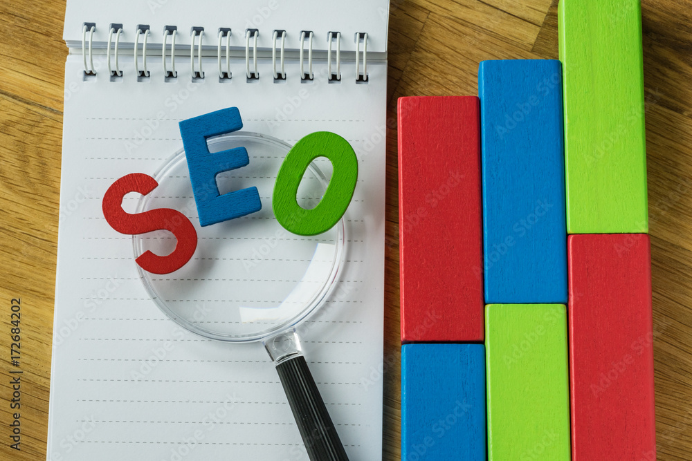Aufkleber search engine optimization concept as colorful alphabet abbreviation seo on magnification glass on n