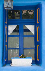 Fototapeta na wymiar old blue painted wooden window