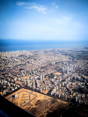 View of Tel Aviv and the Mediterranean Sea from the window of the plane taking off from the airport Ben Gurion