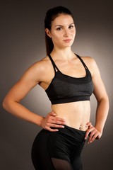 Fototapeta premium Active young fit woman with perfect body pose