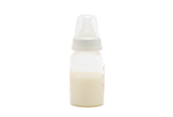 Fresh breast milk in the bottle on white