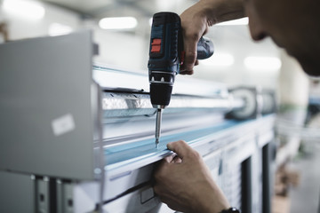Manual worker assembling PVC doors and windows. Manufacturing jobs. Selective focus. Factory for aluminum and PVC windows and doors production.