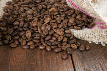 COFFEE GRAIN IN A BAG ON A RURAL TABLE