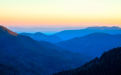 Fototapeta na wymiar blue misty silhouettes of mountains