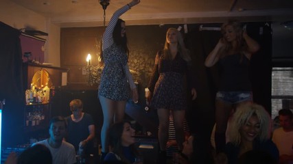  Party crowd dancing in the club, couple getting close on the dance floor - Powered by Adobe