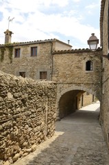 Stone arch in medieval village of  Peratallada, Girona, Spain