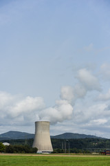 Cooling tower of nuclear power plant against the blue sky chimney landscape