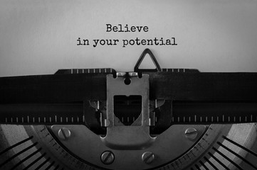 Text Believe in your potential typed on retro typewriter
