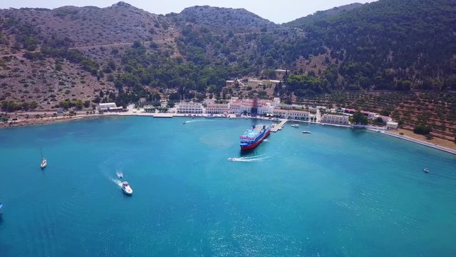 August 2017: Aerial drone video of iconic Archangel Michael of Panormitis bay in island of Symi, Dodecanese, Aegean, Greece
