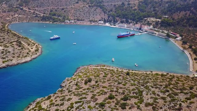 August 2017: Aerial drone video of iconic Archangel Michael of Panormitis bay in island of Symi, Dodecanese, Aegean, Greece