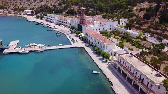 August 2017: Aerial drone video of iconic Archangel Michael of Panormitis bay in island of Symi, Dodecanese, Aegean, Greece