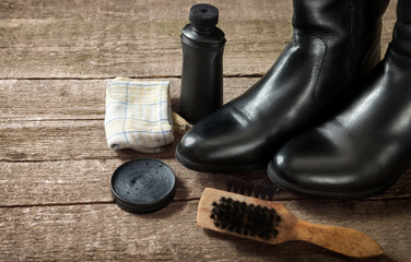 Black boots,polish cream,brush and cloth