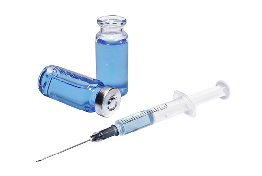 Medical vials with blue vaccine and syringe on white background