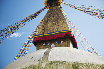 Prayer flags Buddhist stupa illuminated panorama at Boudhanath Kathmandu Nepal 