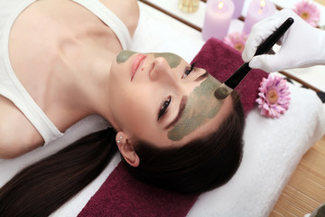 Young, beautiful and healthy woman in spa salon. Traditional oriental massage therapy and beauty treatments.