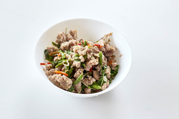 Topped with stir fried pork and basil