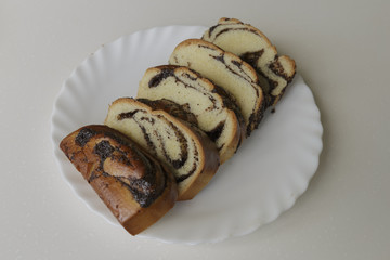 Roll with poppy seeds. White Background.