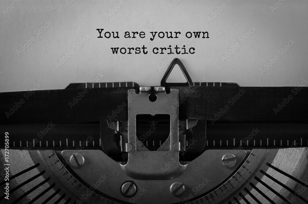 Poster text you are your own worst critic typed on retro typewriter